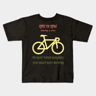 Life is like riding a bike to keep your balance you must keep moving Kids T-Shirt